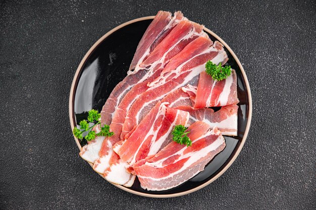 Photo tranche de bacon viande fumée fraîche manger cuisine apéritif repas collation sur la table espace de copie