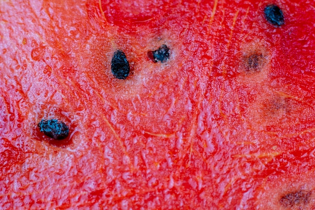 Tranche de pastèque rouge gros plan graine de zoom de fruits frais