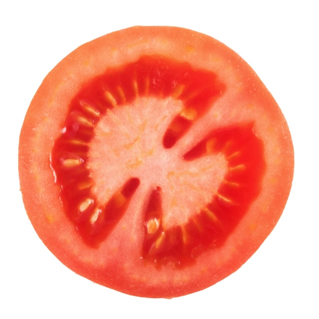 Une tranche de tomate isolée sur fond blanc vue de haut