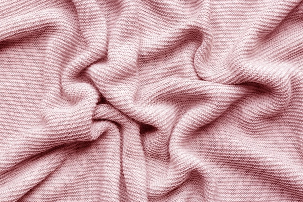 Tricot de laine rose en arrière-plan