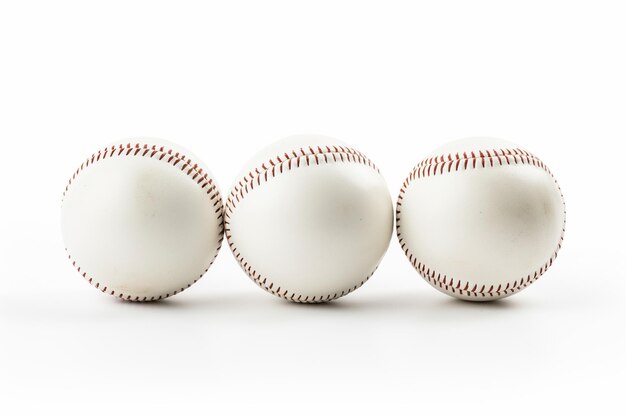 Photo trois balles de baseball sur une blanche