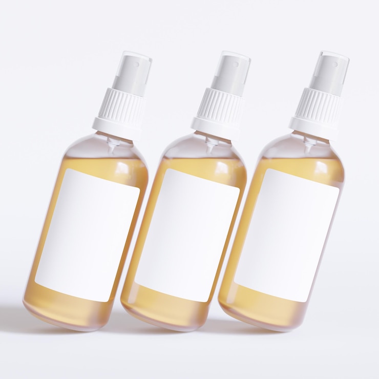Photo trois bouteilles de savon avec des bouchons blancs et des bouches blanches