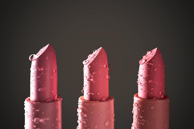 Photo trois rouge à lèvres hydratants avec des gouttes d'eau sur un fond sombre