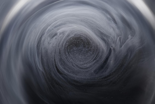 Trou noir de l'espace extra-atmosphérique abstrait. Le trou de ver absorbe la matière. Tourbillon de tornade d'oeil