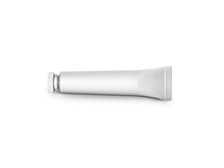 Photo tube de couleur sur fond blanc