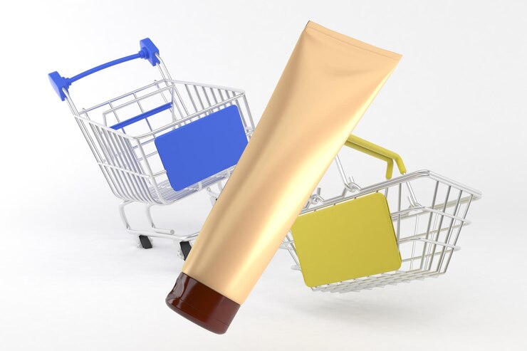Photo tube de crème et caddies flottant sur fond blanc