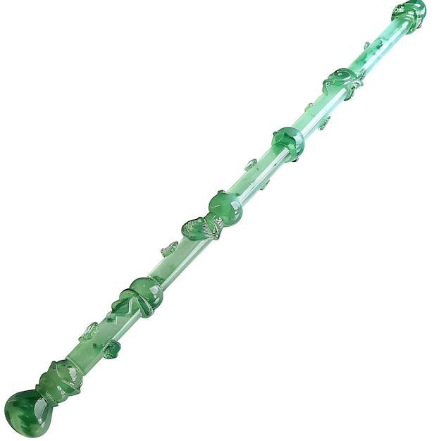 un tube de verre vert avec des pierres précieuses vertes dessus