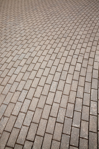 Tuiles de béton sur le chemin piétonnier