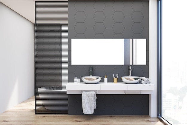 Tuiles hexagonales grises et mur blanc intérieur de la salle de bain avec un double évier debout sur une étagère blanche.