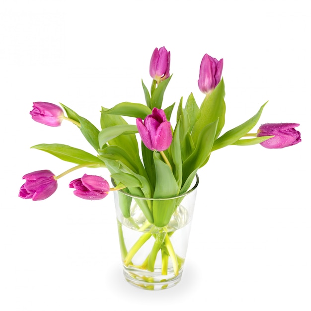 Tulipes dans un vase en verre blanc