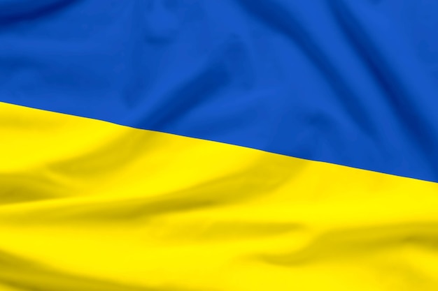 L'Ukraine agitant la texture textile du drapeau