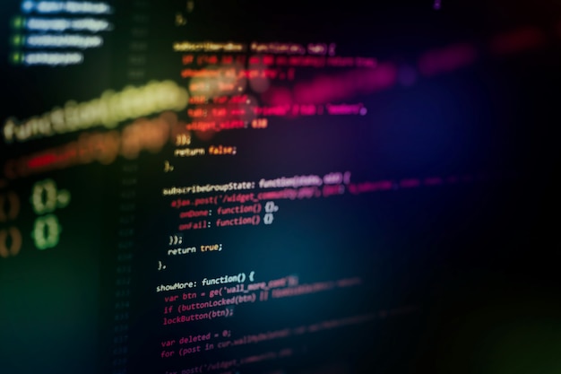 Utilisation de CSS, JavaScript et HTML. Surveiller le gros plan du code source de la fonction. Contexte abstrait de la technologie informatique. Code source du logiciel.