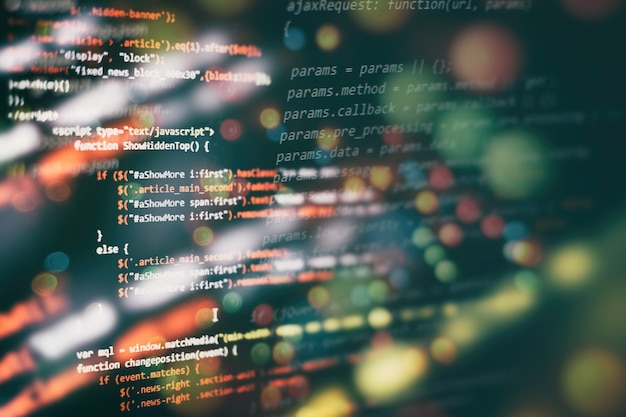 Utilisation de CSS, JavaScript et HTML. Surveiller le gros plan du code source de la fonction. Contexte abstrait de la technologie informatique. Code source du logiciel.