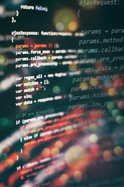 Utilisation de CSS, JavaScript et HTML. Surveiller le gros plan du code source de la fonction. Contexte abstrait de la technologie informatique. Code source du logiciel.
