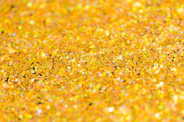 vacances, décoration et concept de texture - arrière-plan paillettes dorées ou paillettes jaunes