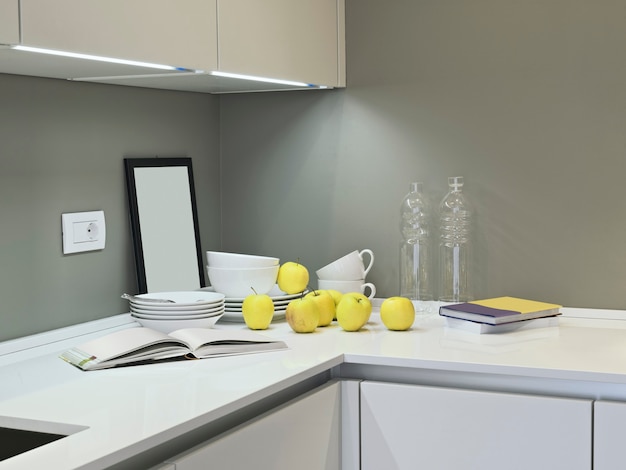 Vaisselle et pommes sur le plan de travail dans la cuisine moderne