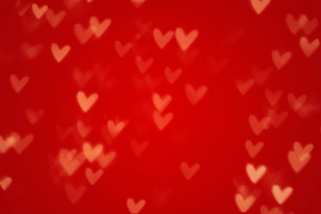 Valentine heart bokeh lights sur fond rouge