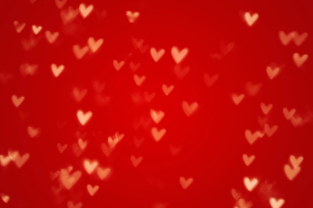 Valentine heart bokeh lights sur fond rouge