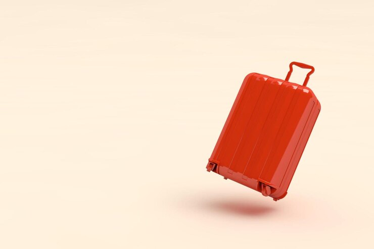 Photo une valise de voyage rouge sur fond blanc