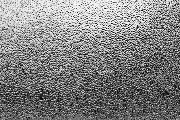 Vapeur d&#39;eau dans un verre froid de fenêtre. Fond d&#39;hiver