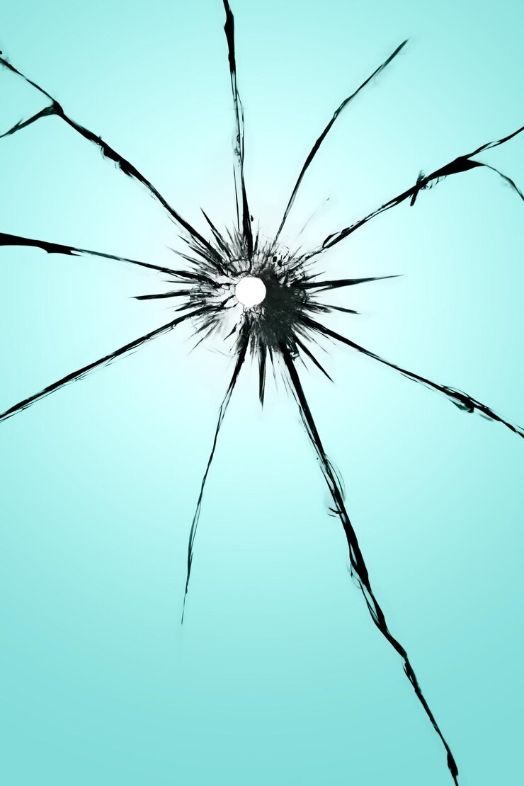 Photo verre fissuré avec un trou de balle de texture de fenêtre cassée