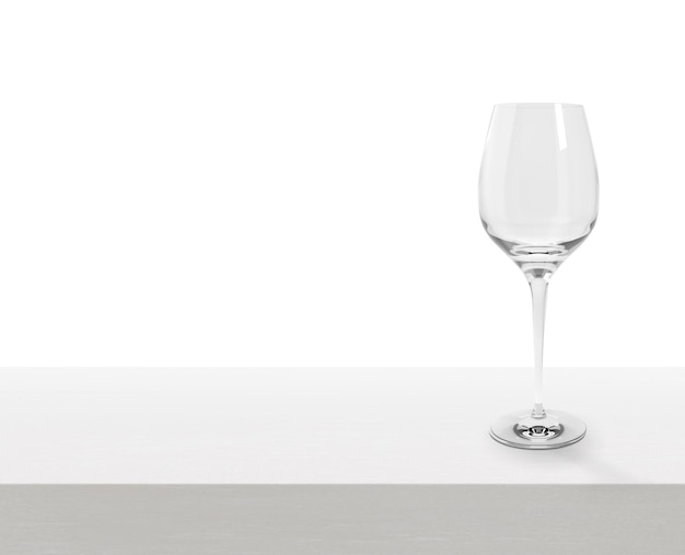 Verre à vin vide sur une table en bois blanche avec espace de copie