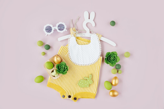 Vêtements de bébé de printemps. Body tricoté sur un joli cintre avec des oreilles de lapin avec des décorations de Pâques et des œufs sur fond rose pâle. Notion de vacances. Mise à plat, vue de dessus