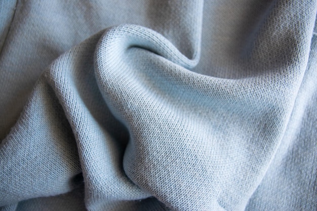 Photo vêtements en coton bleu à texture douce fond de tissu textile