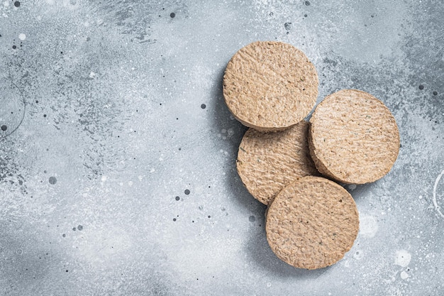 Viande crue sans viande Burger à base de plantes escalopes végétariennes Fond gris Vue de dessus Espace de copie