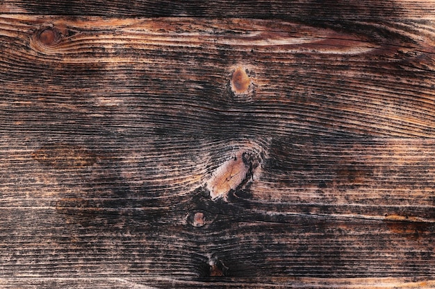Vieille planche de bois brut pour fond texturé agrandi