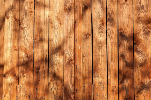 Vieille texture en bois, clôture en planches de bois se bouchent.