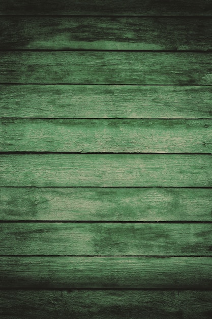 Vieilles planches de bois minable vert avec peinture de couleur craquelée