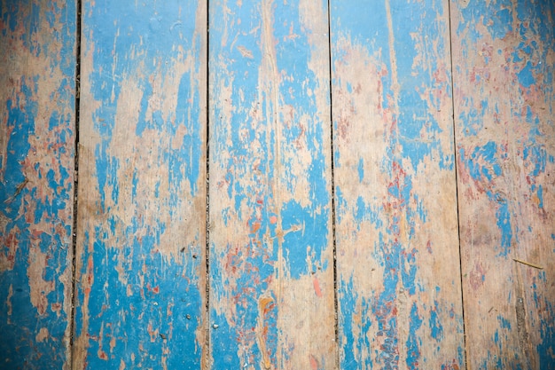 Vieilles planches de bois peintes en bleu et beige vintage. Texture de fond rustique.