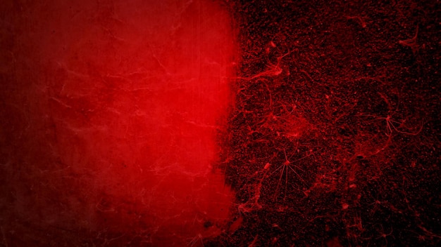 De vieilles toiles d'araignées rouges sur le mur ressemblent à un risque biologique de virus