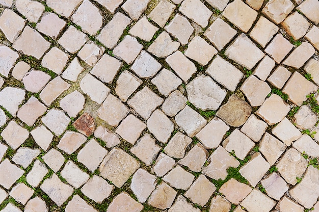 Vieux fond de chaussée de pierre beige