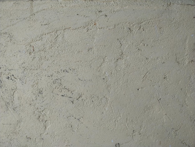 vieux mur de béton fissuré avec fond de surface en ciment