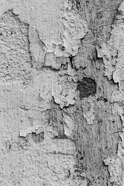 Vieux mur de béton rayé noir et blanc