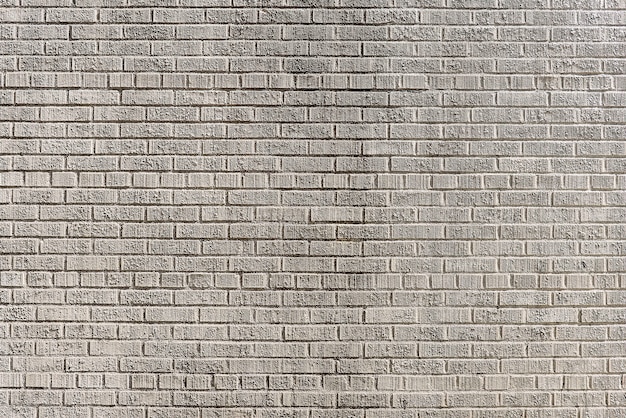Vieux mur de brique gris