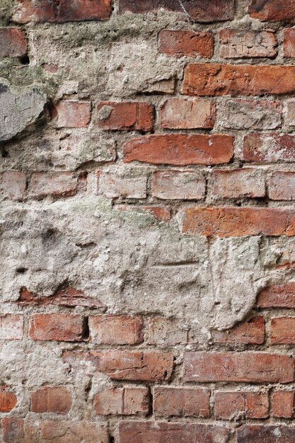 Vieux mur de brique rouge détruit texture de fond