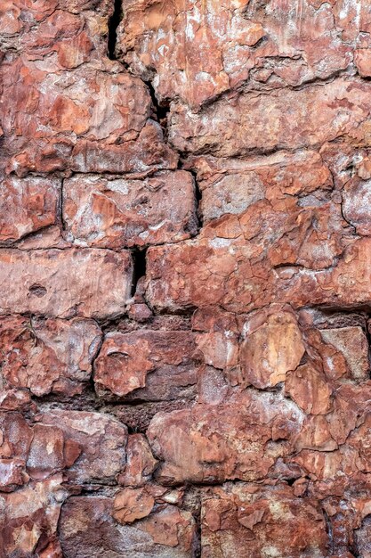 Vieux mur de briques cassé avec texture de plâtre de ciment de ruine pour le fond