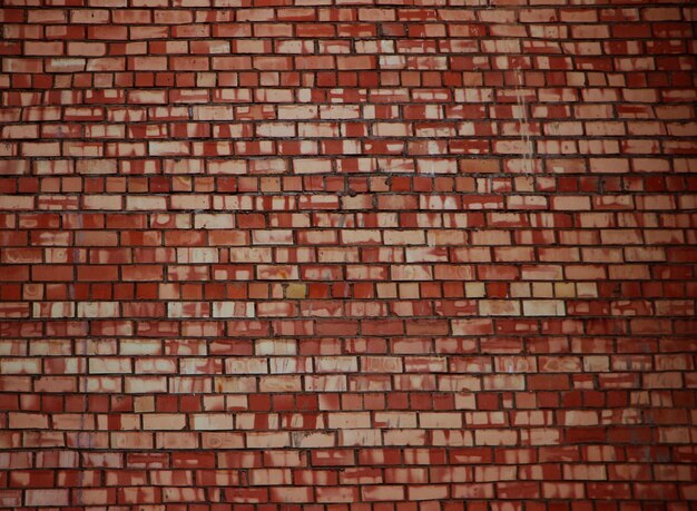 Vieux mur de briques rouges altérées fond vintage grundge