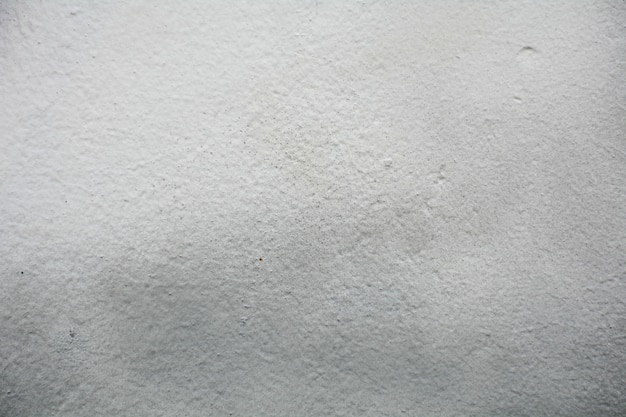 Vieux mur de ciment blanc