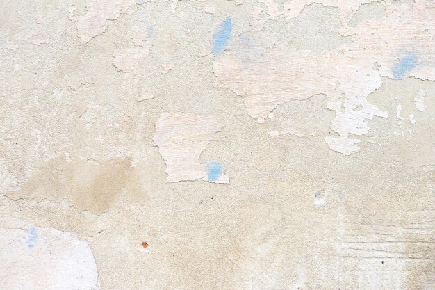 Vieux mur feuilleté avec du plâtre détruit Rénovation de la vieille maison Fond de mur de conception de style industriel Grunge mur de béton fissuré avec de la vieille peinture Shabby peeling vieille texture de fond