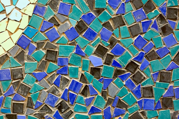 Vieux mur de mosaïque en céramique comme arrière-plan.