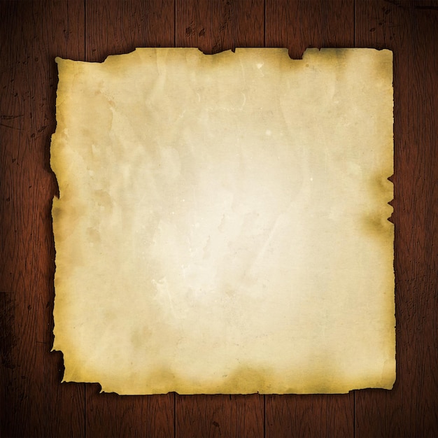 Vieux papier sur fond de bois