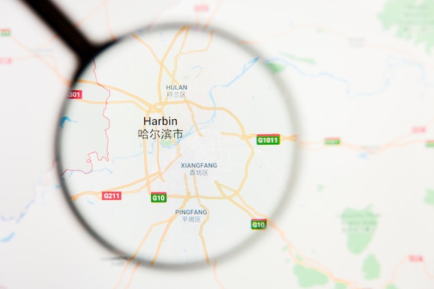 Photo visualisation de la ville de haerbin concept d'illustration sur l'écran d'affichage à travers la loupe