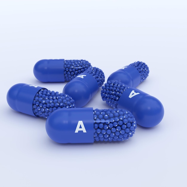 Vitamine A Capsules bleues Granules et Whtie Contexte