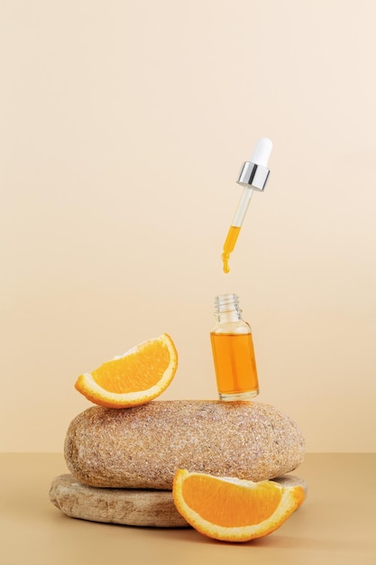 Vitamine C sérique en bouteille cosmétique tranches d'agrumes orange Huile essentielle d'agrumes cosmétiques aromathérapie