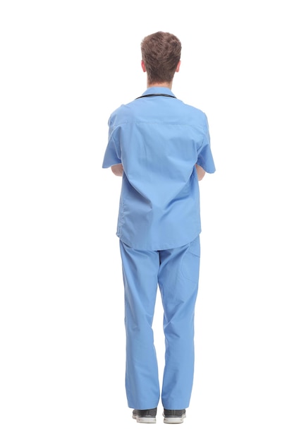 Vue arrière du médecin debout en robe bleue