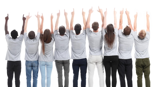 Vue arrière d'un groupe de jeunes gens partageant les mêmes idées pointant vers le haut